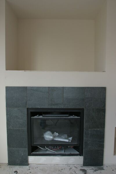 Green slate surrounds the gas fireplace