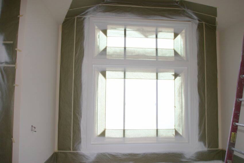 Living Room - new millwork and fresh paint on the front window