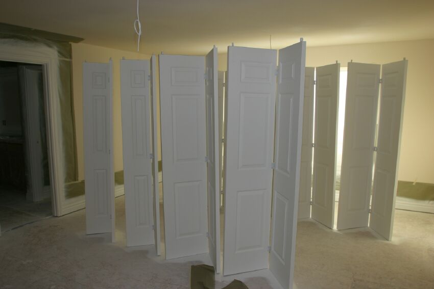 Master bedroom doubles as a paint shop for closet doors