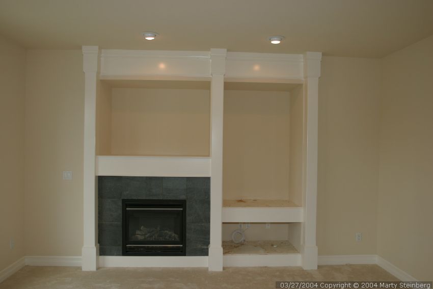 Lights are in, carpet is in, fireplace is all trimmed out.