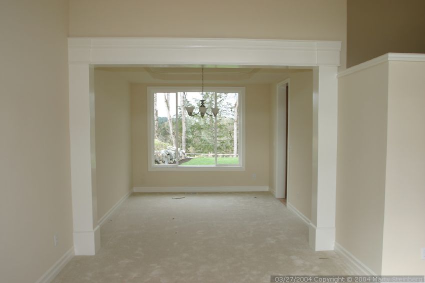 Carpet is in, dining room chandelier is hung.