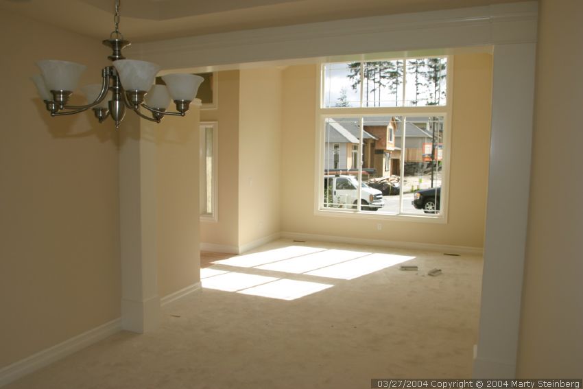 Carpet is in, dining room chandelier is hung.